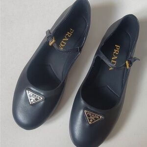 Prada Black Leather Mary Jane Flats with Gold Triangle Emblem